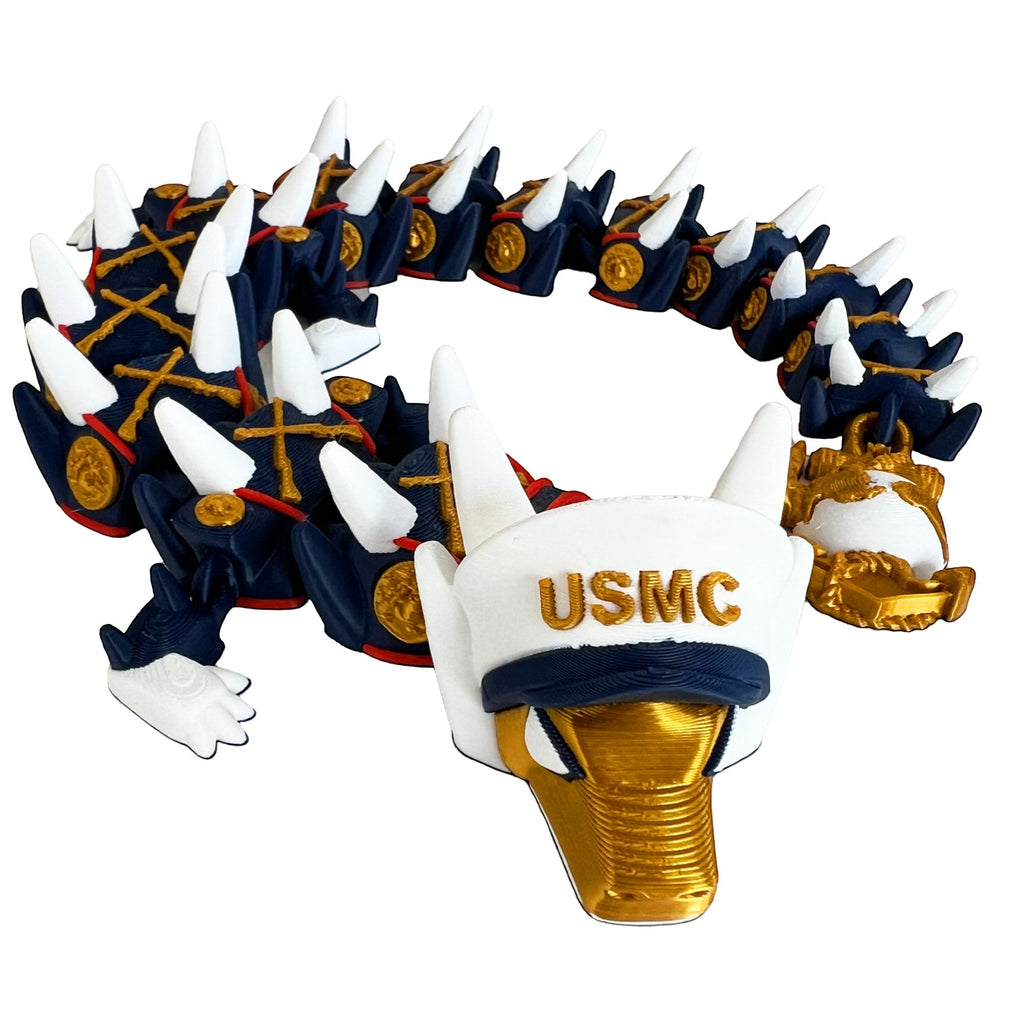 Crafted For Courage USMC Dragon figurine with white USMC hat, gold accents, and dark blue segmented body with white spikes.