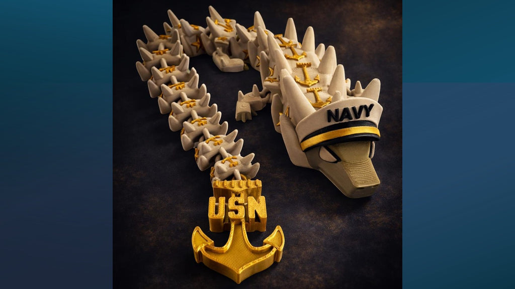 Crafted For Courage USMC Dragon toy with USN anchor and navy hat.