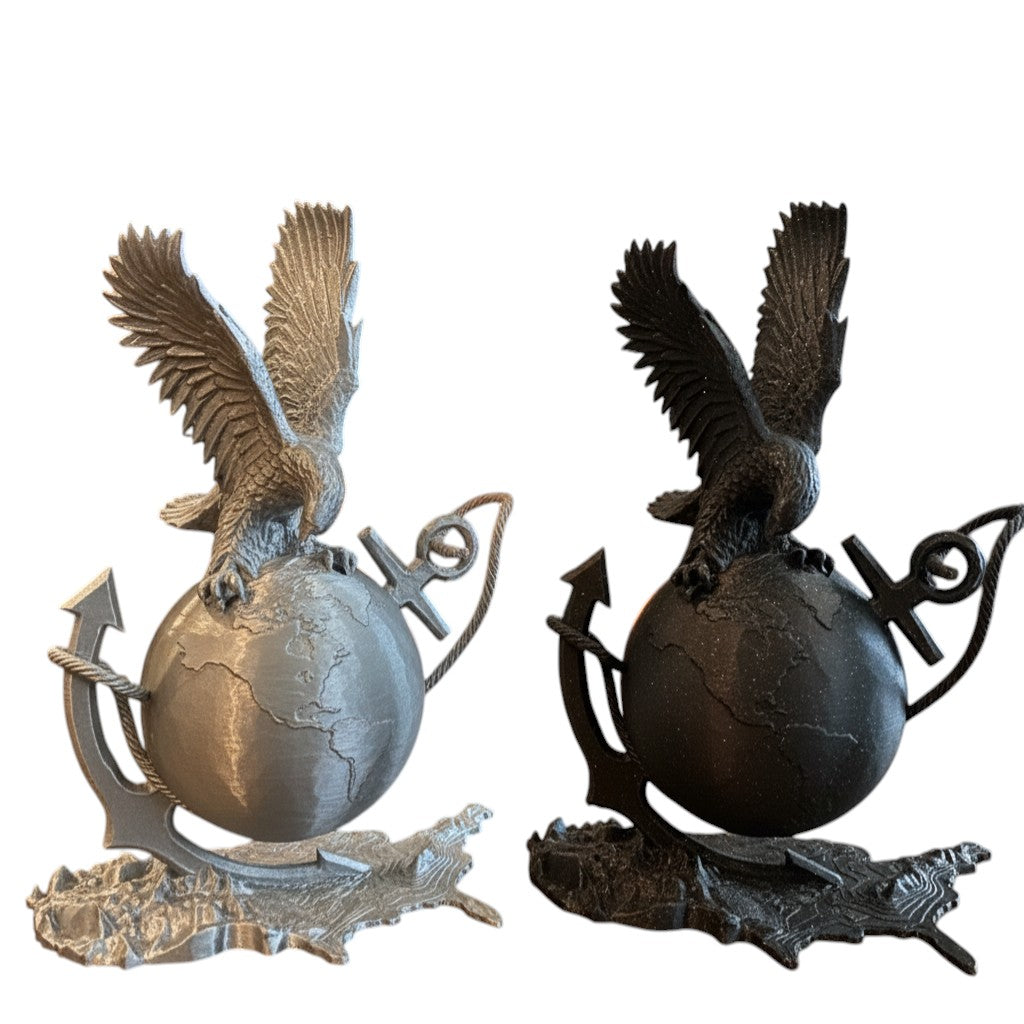 Crafted For Courage USMC eagle perched on a globe with anchors and rope, available in silver and black finishes.